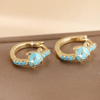Gouden oorbellen met turquoise schildpadje