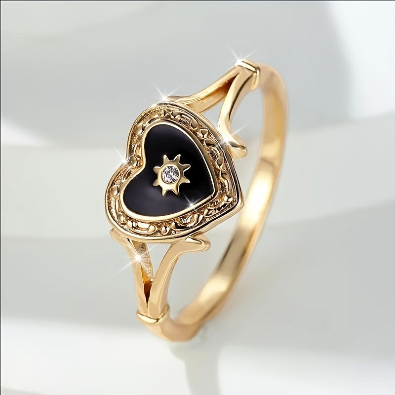 Gouden ring met zwart geëmailleerd hart en zonnetje