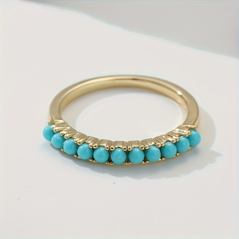 Gouden ring met rij turquoise kralen