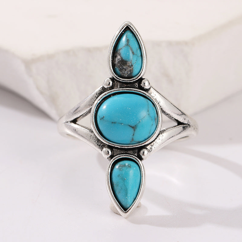Zilveren ring met drie turquoise edelstenen