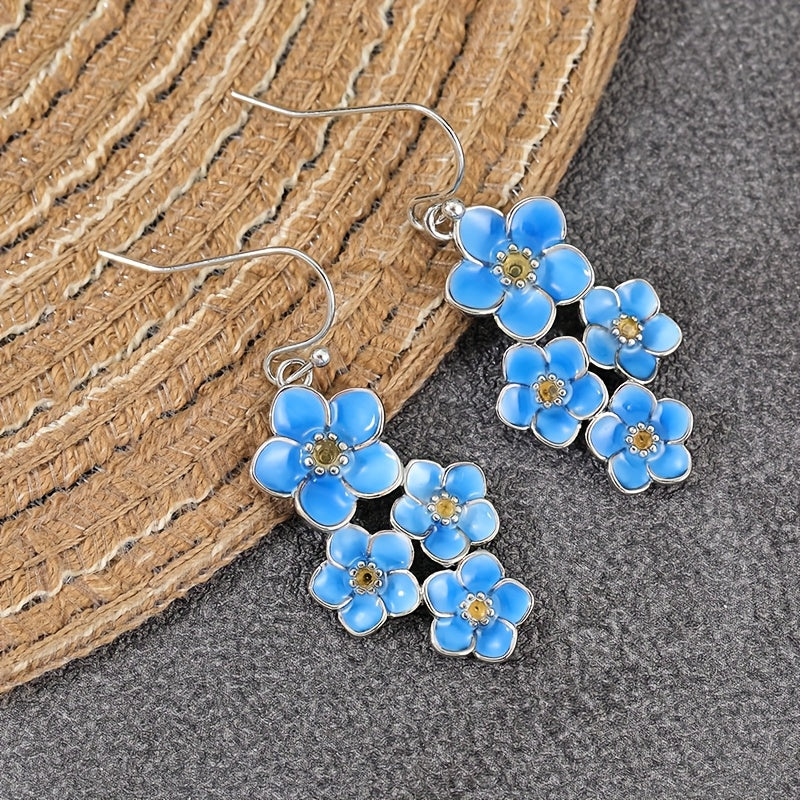 Zilveren oorbellen met blauwe emaille bloemen