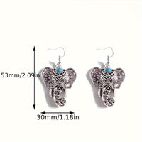 Zilveren boho olifant oorbellen met turquoise