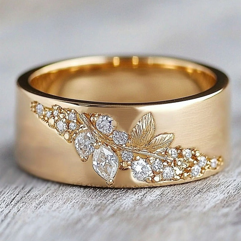 Gouden ring met blaadjesmotief en zirkonia