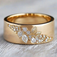 Gouden ring met blaadjesmotief en zirkonia