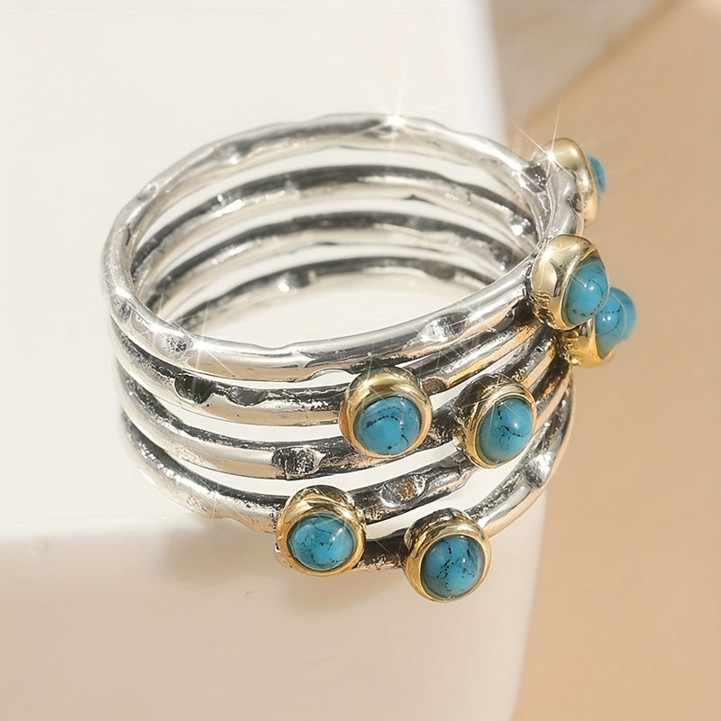 Zilveren ring met turquoise edelstenen en goudaccent
