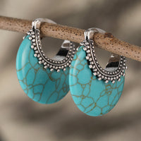 Zilveren bohemian oorbellen met turquoise schijf