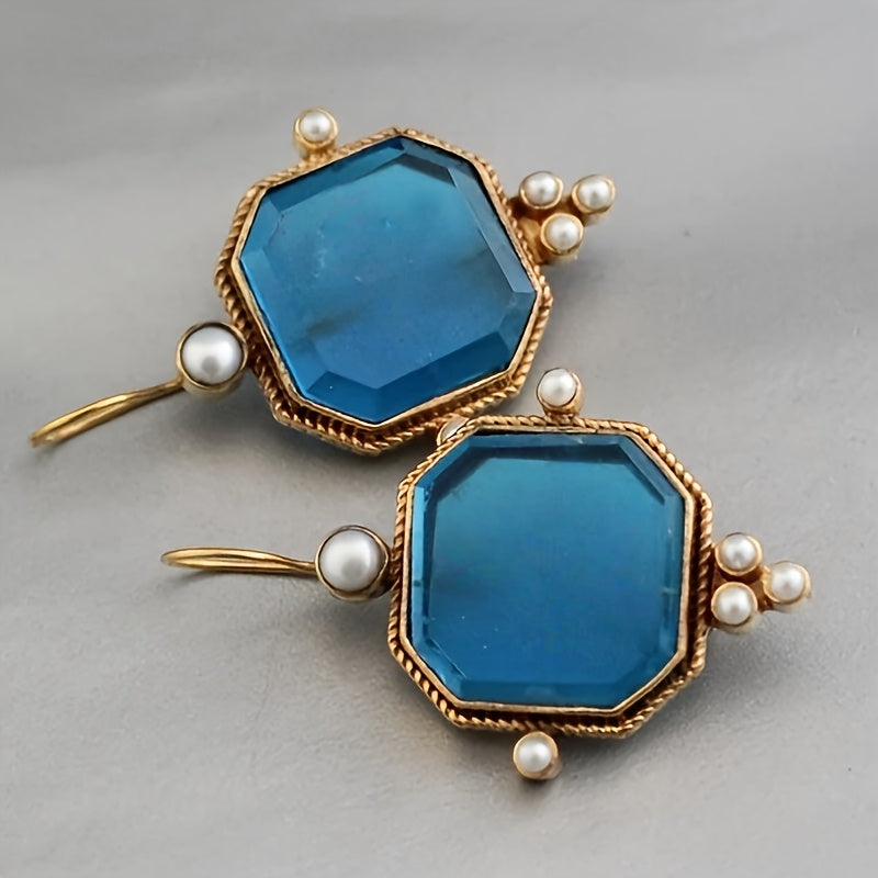 Gouden vintage oorbellen met blauwe glassteen en parels