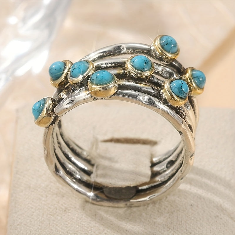 Zilveren ring met turquoise edelstenen en goudaccent