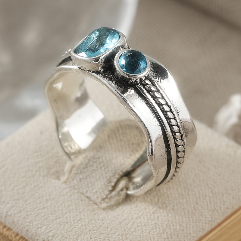 Zilveren ring met twee aquablauwe edelstenen