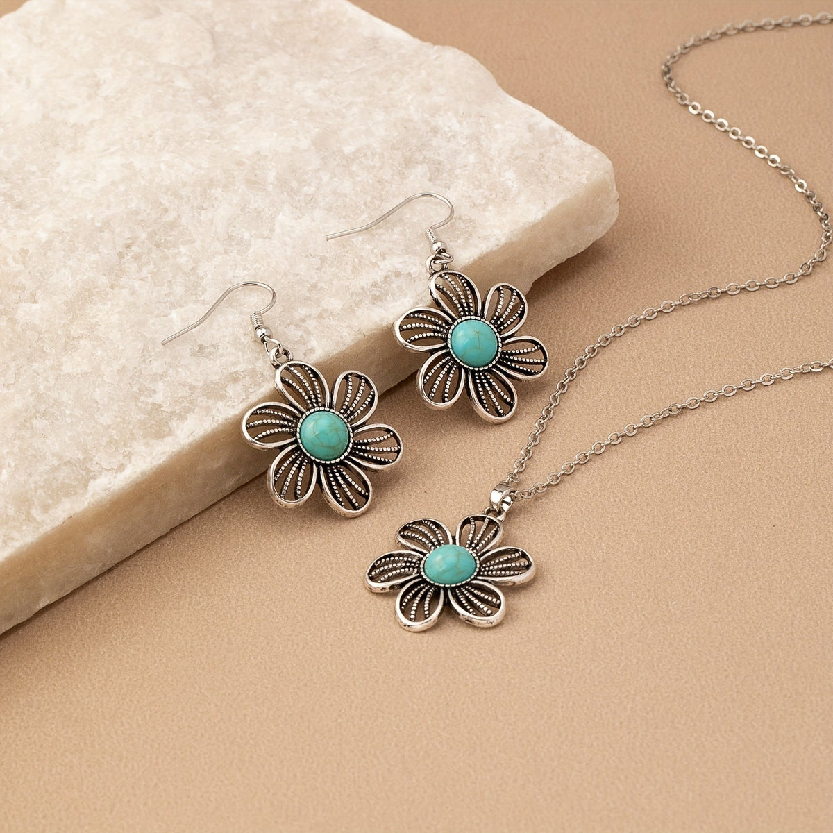 Zilveren bloemenset ketting en oorbellen met turquoise