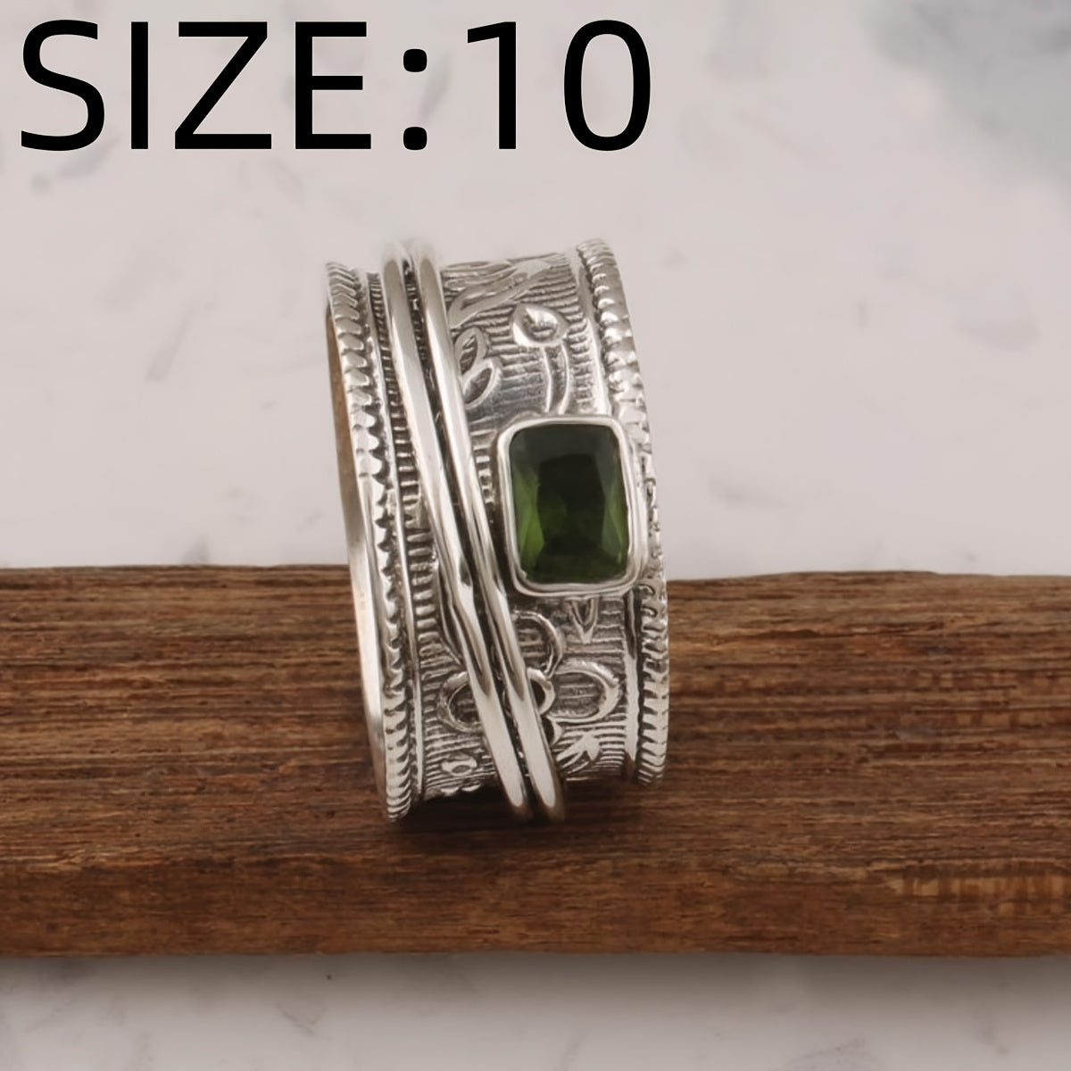 Zilveren brede ring met groene edelsteen