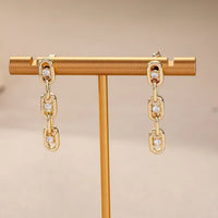 Gouden schakeloorbellen met zirkonia