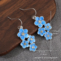 Zilveren oorbellen met blauwe emaille bloemen