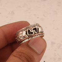 Zilveren spinner ring met hartjes en bloemen