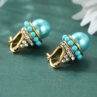 Vintage gouden oorbellen met turquoise parel