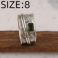 Zilveren brede ring met groene edelsteen