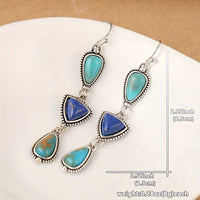 Zilveren oorbellen met turquoise en lapis druppels
