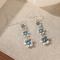 Zilveren bohemian bloemenoorbellen met turquoise