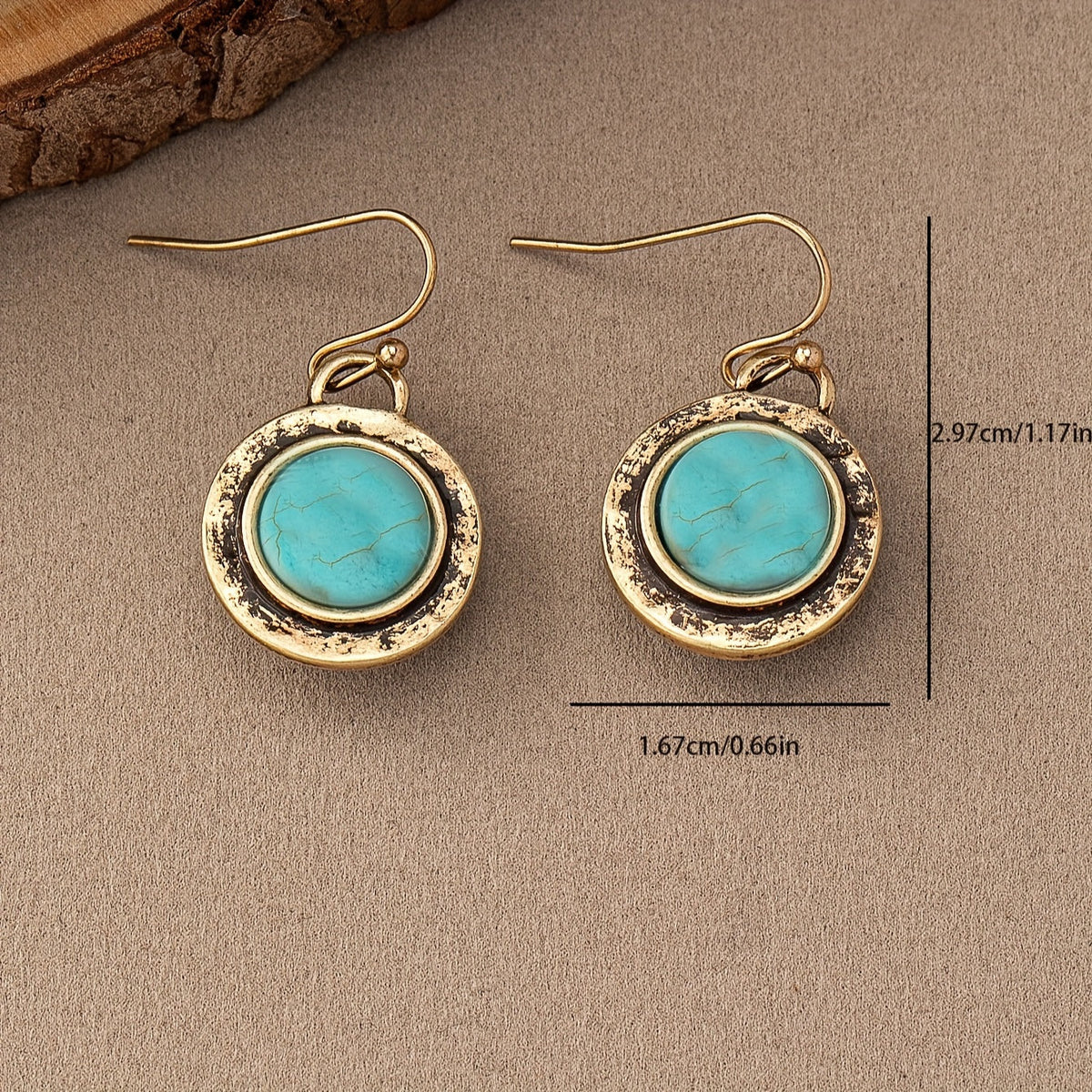 Goudkleurige vintage oorbellen met ronde turquoise