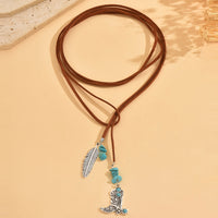 Bohemian ketting met turkooizen kralen en veerhanger