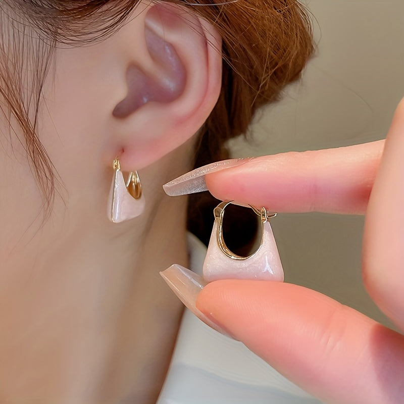Gouden oorbellen met parelmoer handtasje