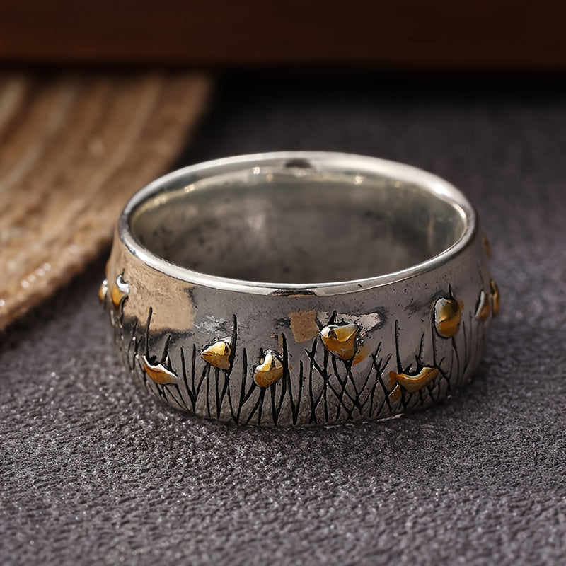 Zilveren vintage ring met gouden vogels en bladeren