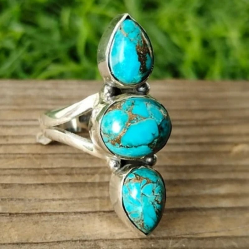 Zilveren ring met drie turquoise edelstenen