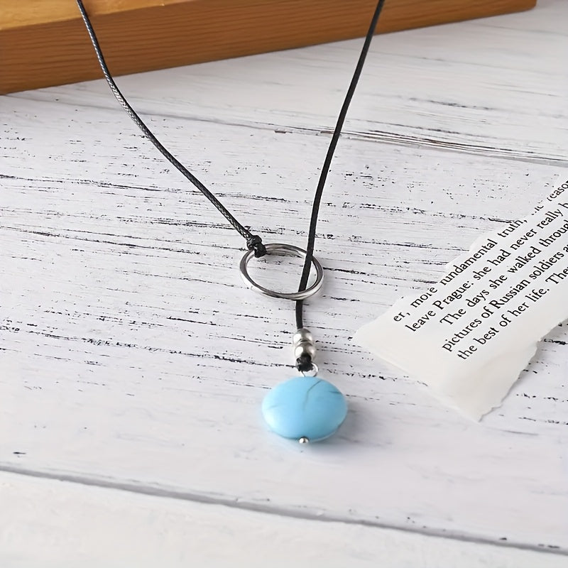 Minimalistische ketting met zilveren ring en turkooizen steen