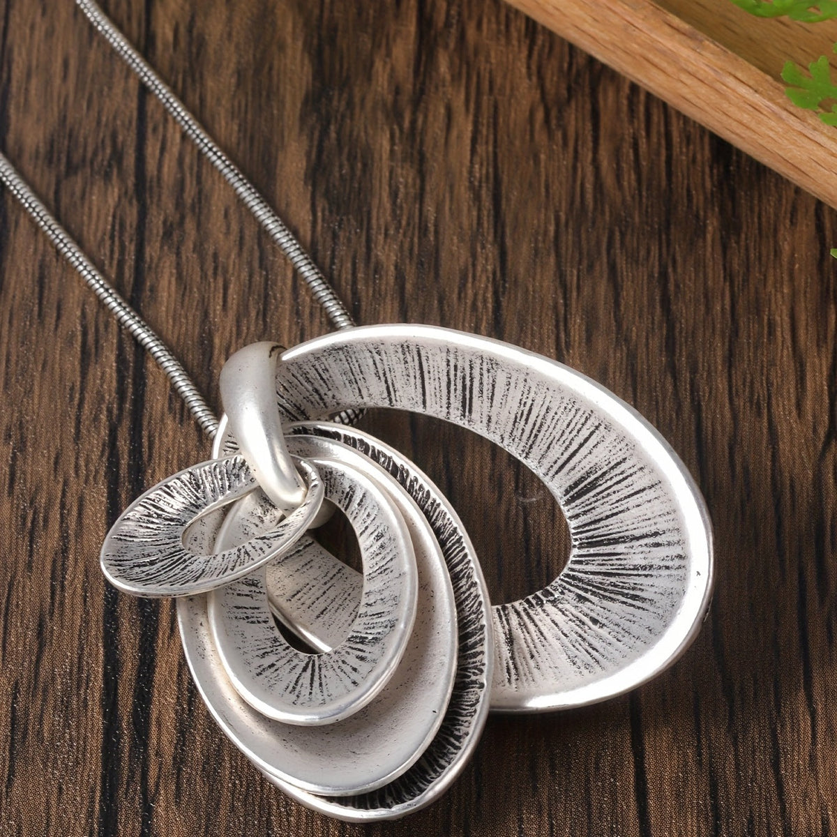 Zilveren ketting- en oorbellenset met gelaagde ovale hanger