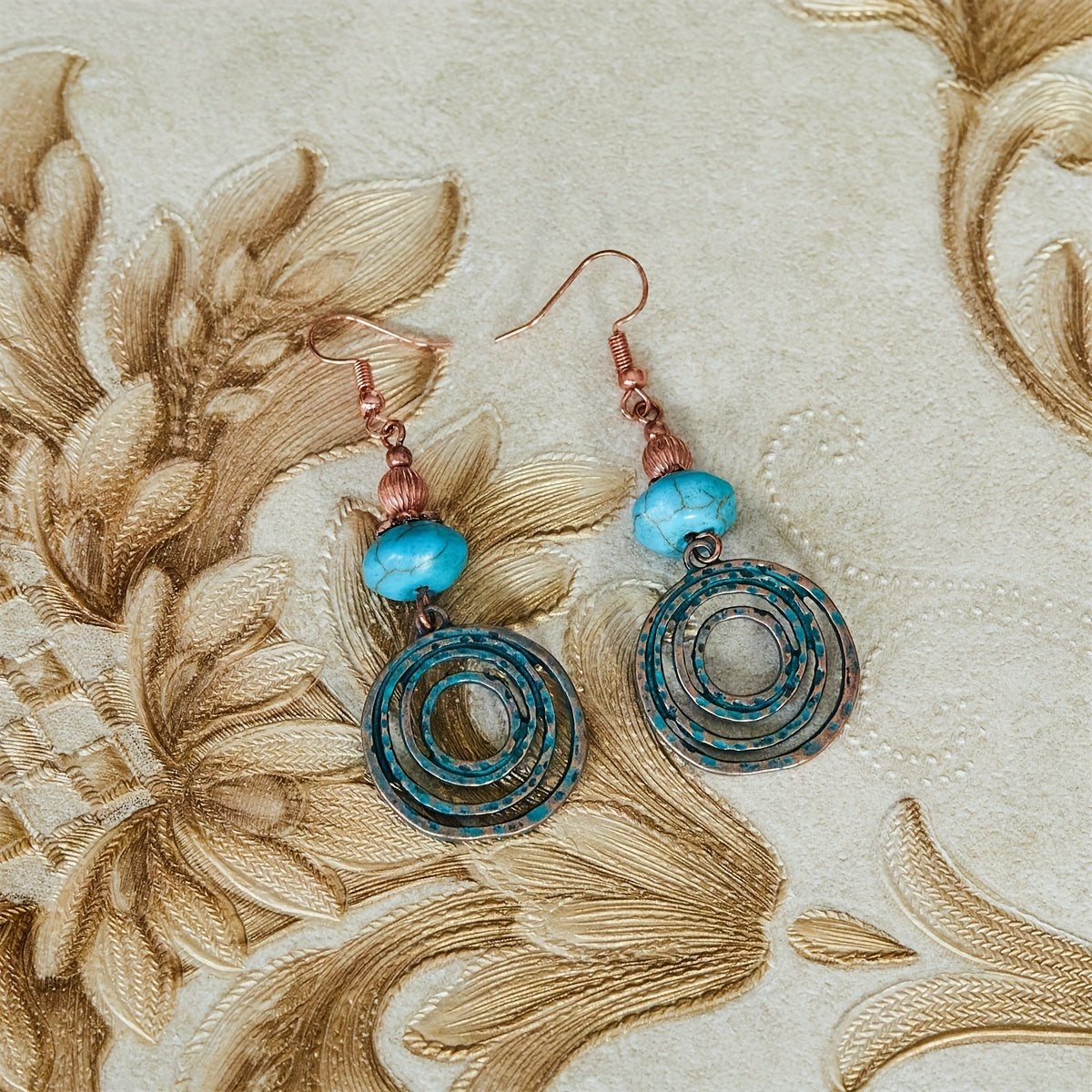 Bohemian oorbellen met roségoud spiraal en turquoise