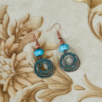 Bohemian oorbellen met roségoud spiraal en turquoise