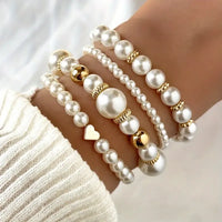 Parel armbandenset met gouden accenten en hartje