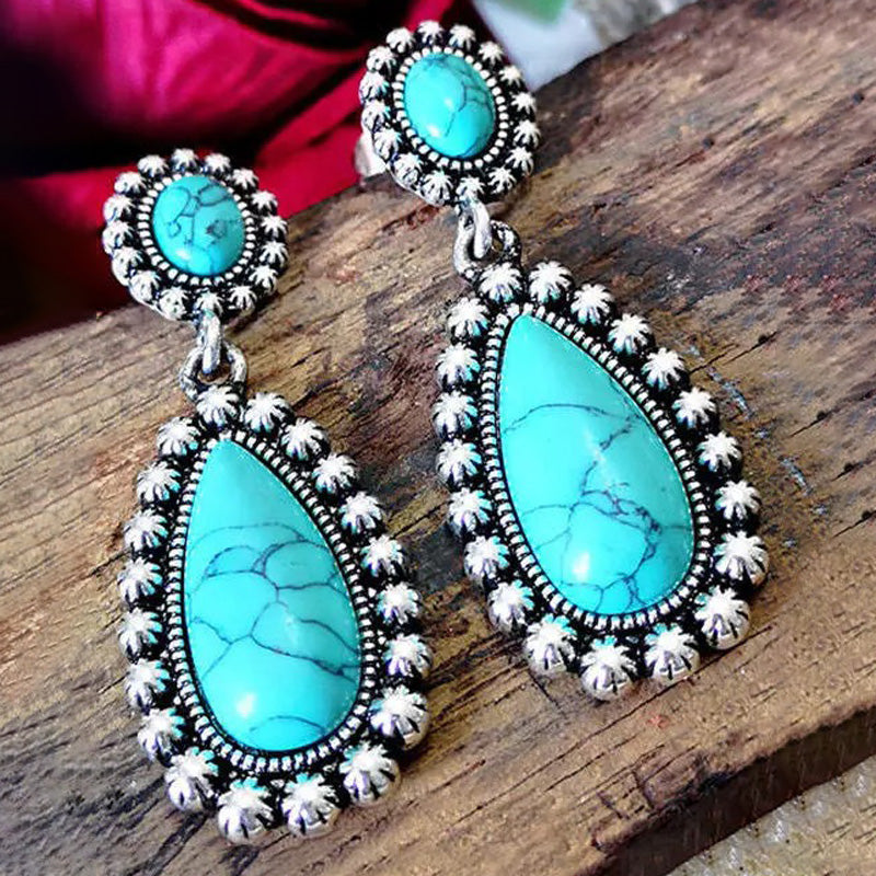 Zilveren oorbellen met turquoise druppels