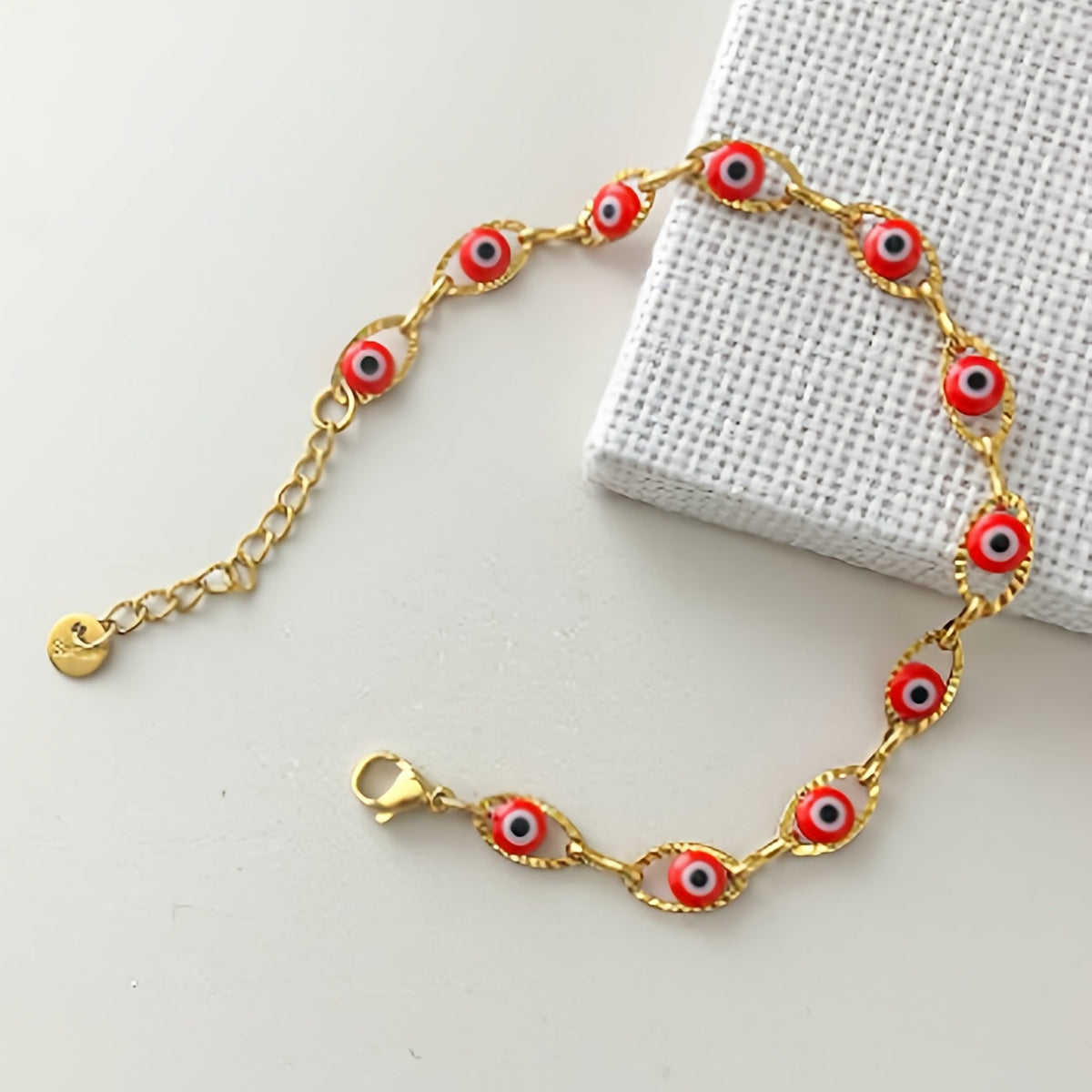 Gouden armband met blauwe boze oog kraaltjes