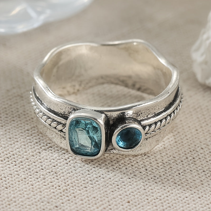 Zilveren ring met twee aquablauwe edelstenen