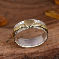 Zilveren gouden draairing met hart