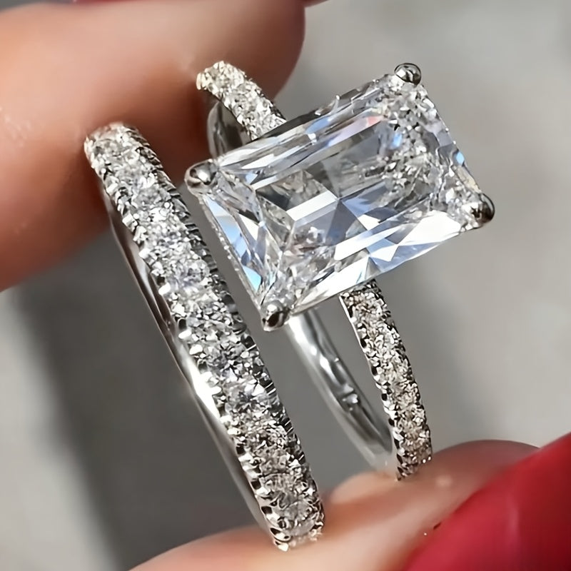 Zilveren ringenset met emerald-geslepen zirkonia en pavé band