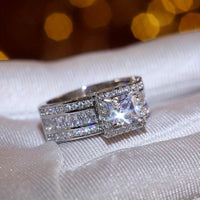 Zilveren halo ring met prinses geslepen zirkonia