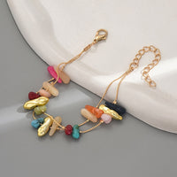 Gouden armband met kleurrijke natuursteen chips