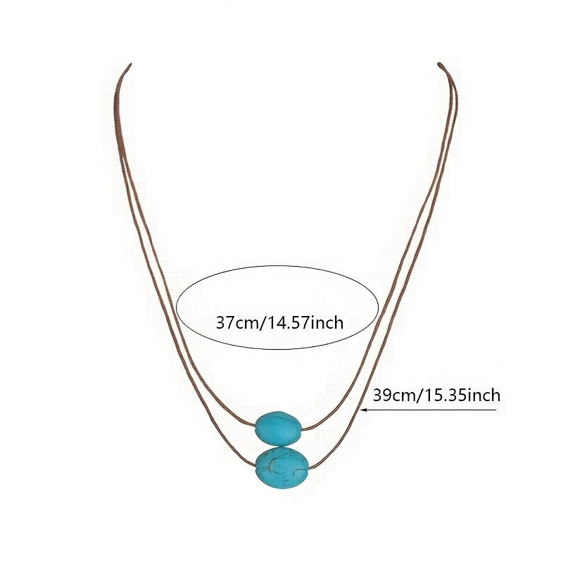 Bohemian ketting met turkooizen hanger en zilveren kwastjes