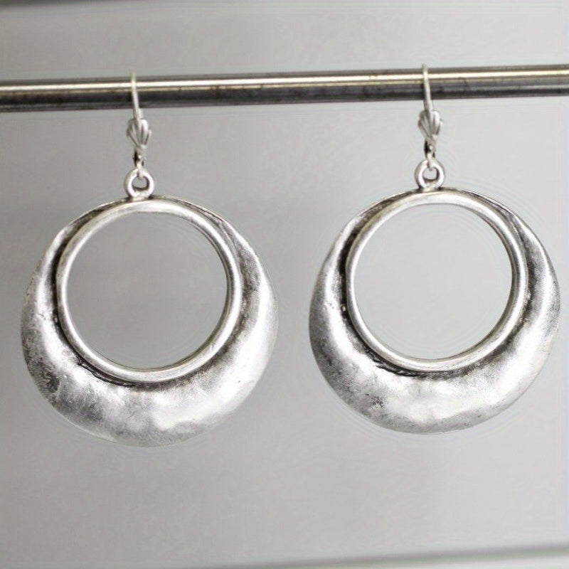 Zilveren bloemoorbellen met turquoise steen