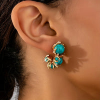 Gouden ring met ovale turquoise edelsteen