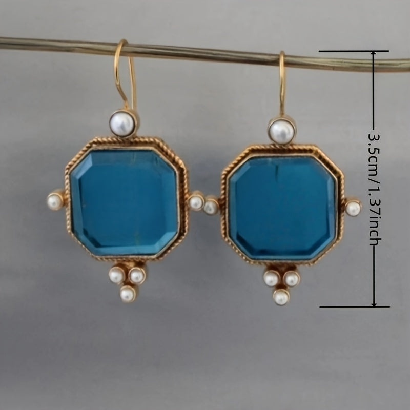 Gouden vintage oorbellen met blauwe glassteen en parels