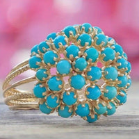 Gouden ring met turquoise bloemcluster