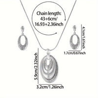 Zilveren ketting- en oorbellenset met gelaagde ovale hanger