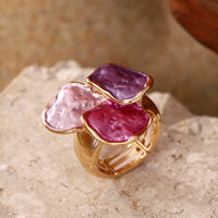 Roségouden ring met roze en paarse edelstenen