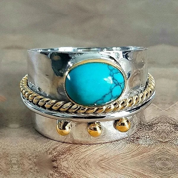 Zilveren brede ring met turquoise en goudaccenten