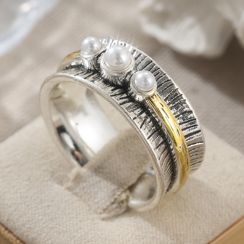 Zilveren ring met parels en goudkleurige spinner band