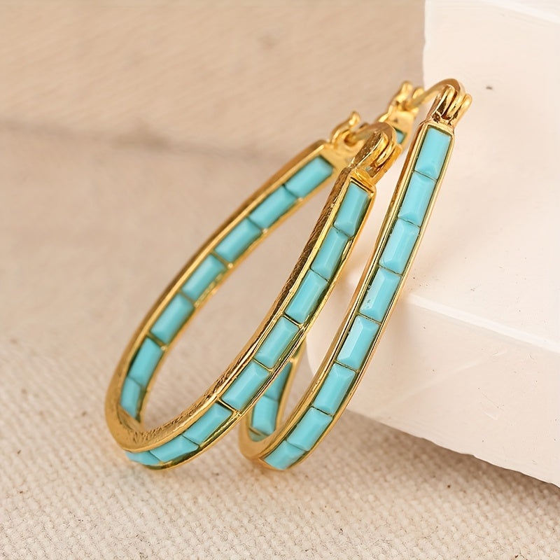 Gouden ovale oorbellen met turquoise