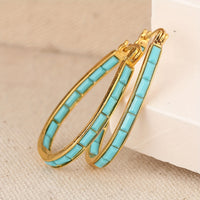 Gouden ovale oorbellen met turquoise